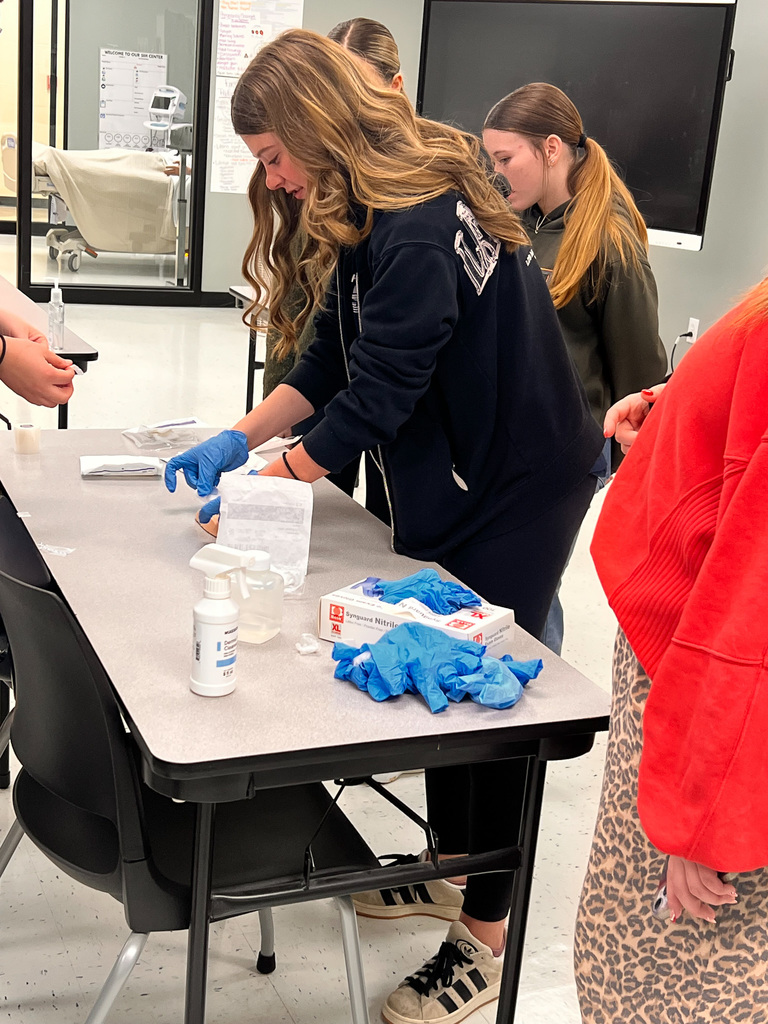 students practicing first aid