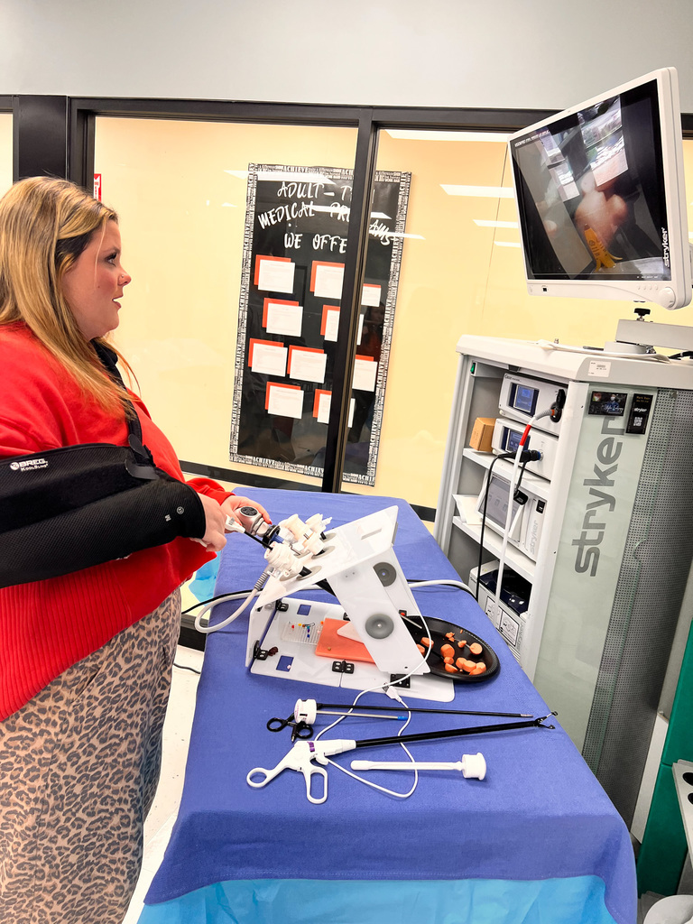 student using the robotic surgery machine