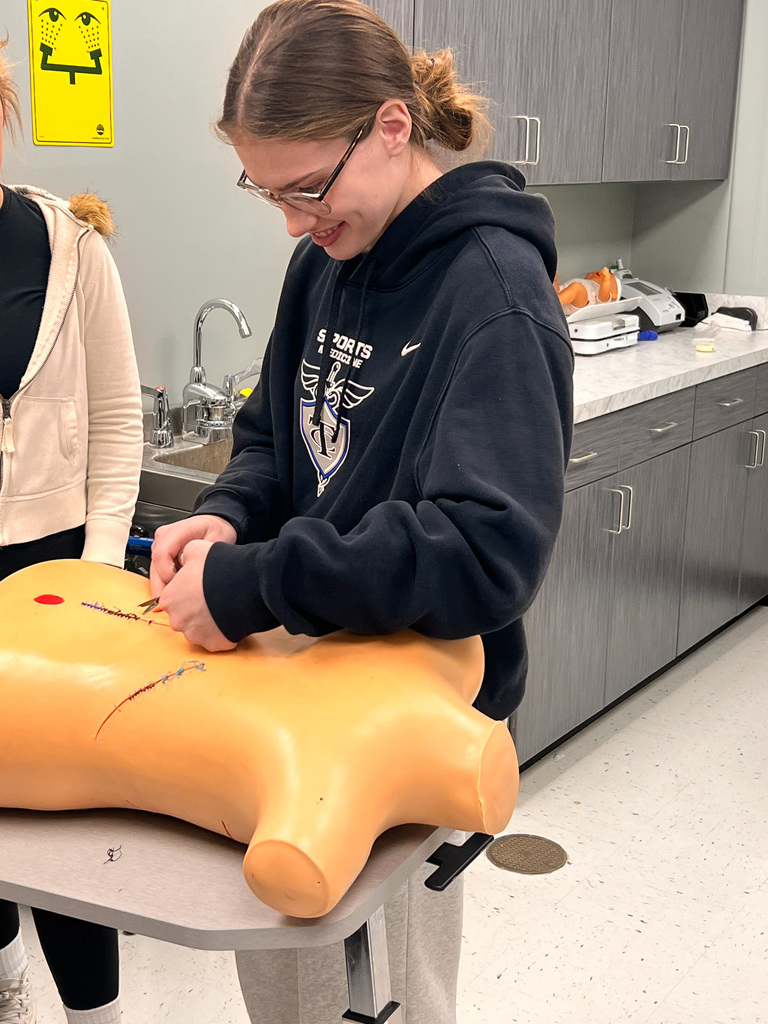 students simulating sutures