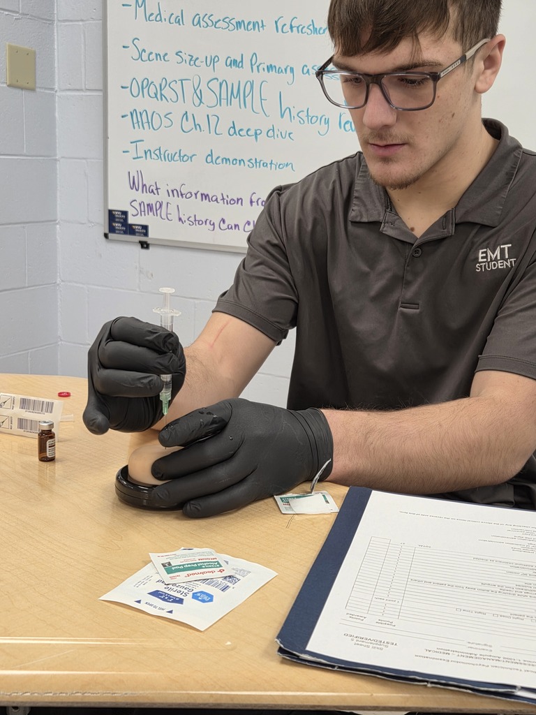 student practicing IM injection