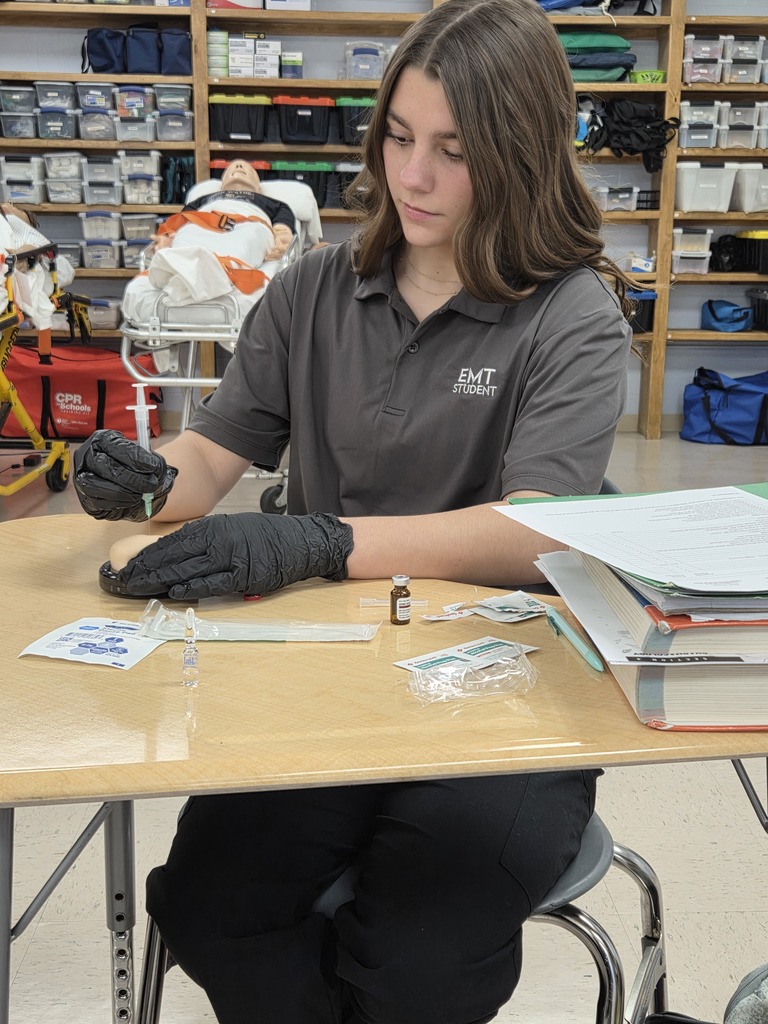 student practicing IM injection