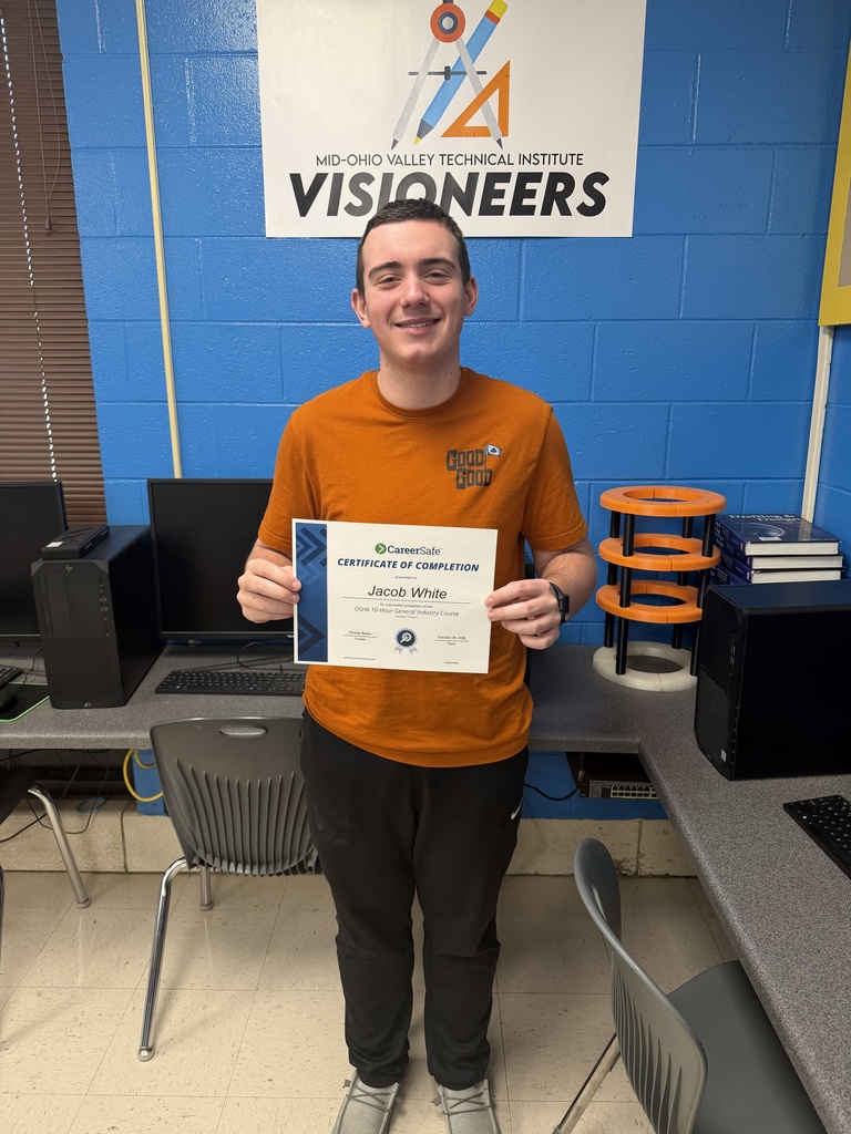 student holding certificate