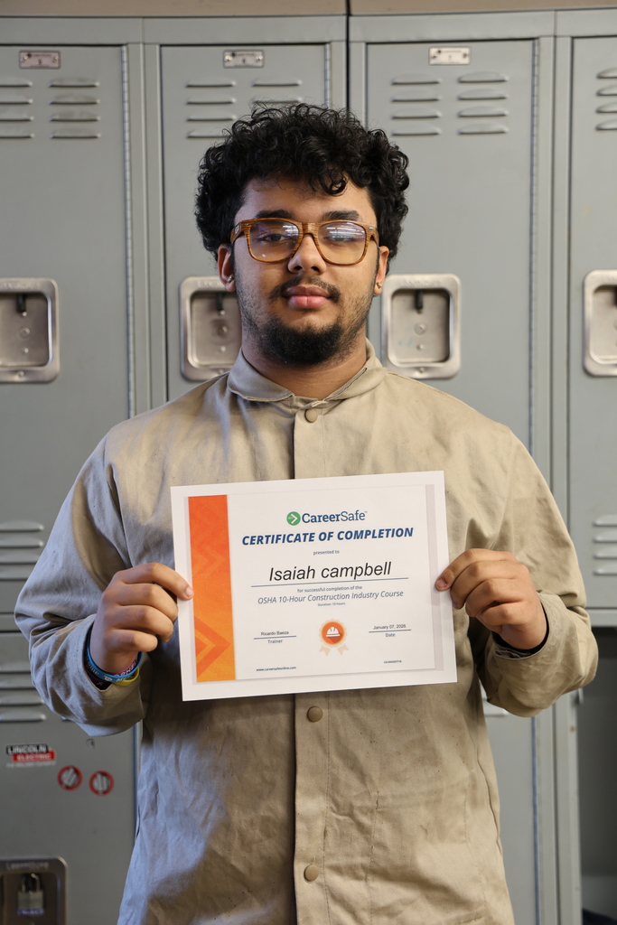 student holding certificate