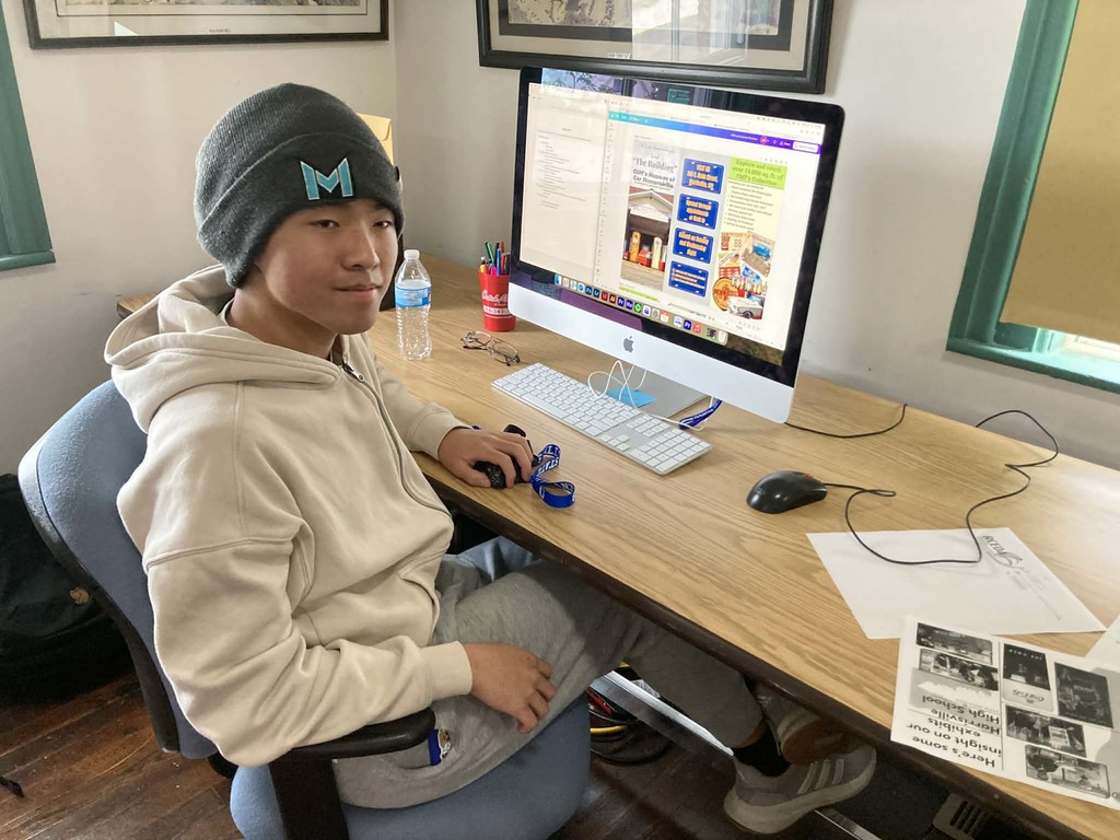 student with computer