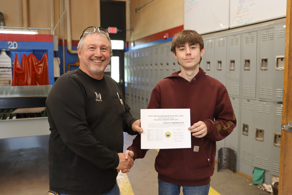 instructor and student with certification