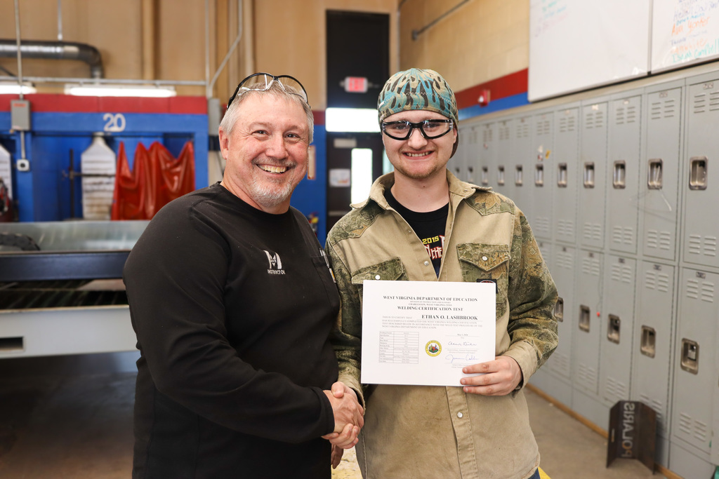 instructor and student with certification