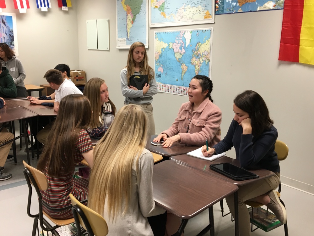 Students discuss a variety of topics to students at Xavier