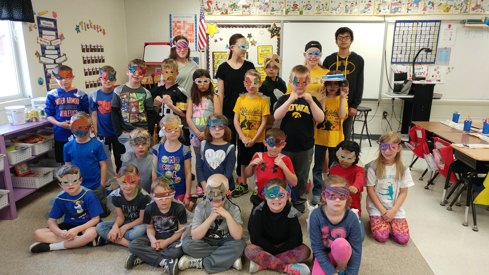 MPMS students help MP East students make superhero masks and capes from recycled materials. 