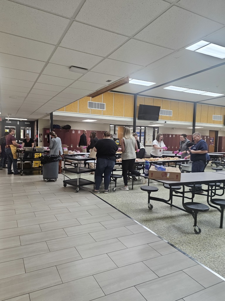 Staff members making lunches for students