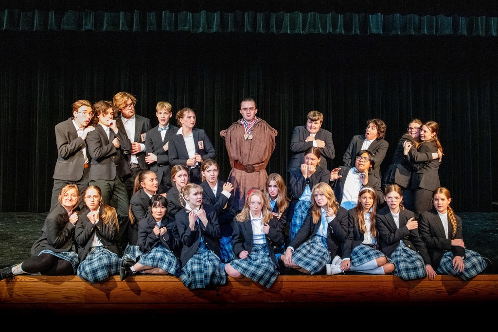 Front row, Kenna Schrock, Fiona McClellen (Tommi), Rita Du (Entertainer), Ryann Dolan (Amanda Thripp), Jillian Clark (Matilda), Wren Harris (Alice), Maëlys Beachy (Nigelina), Addison Skelton, and Lilly Redig. Second row: Samantha Wunderlich (Hortensia), Destina Moyle, Sophia Puttmann (Erica), Georgia White (Lavender), Gwendolyn Wunderlich, and Diego Sanchez (Bruce Bogtrotter). Back Row: Niah Leaton (Sergei), Lincoln Wulf (Rudolpho), Hunter Miller (Henchman), Marq Lucas, Grace Puttmann (Doctor), Jeremiah Rempel (Trunchbull), Eli Tandy (Henchman), Ben Trotta (Henchman), Emma Poock, and Addyson Asher.