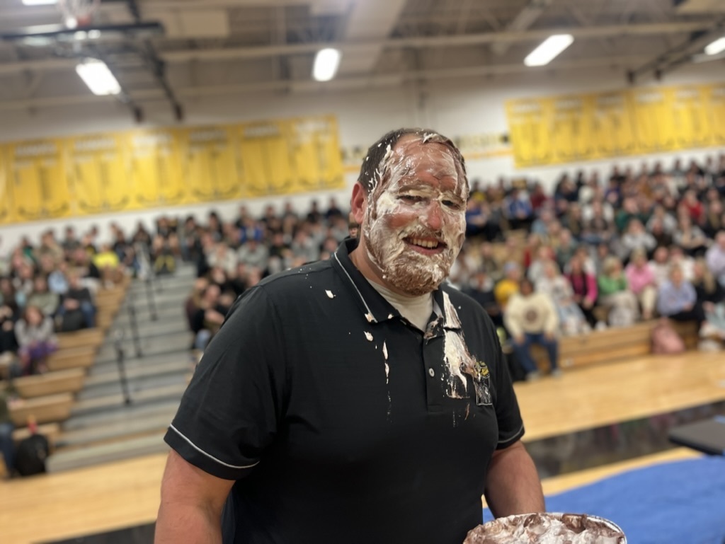 Teacher with a pie in his face