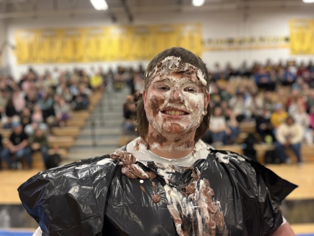 Teacher with a pie in his face