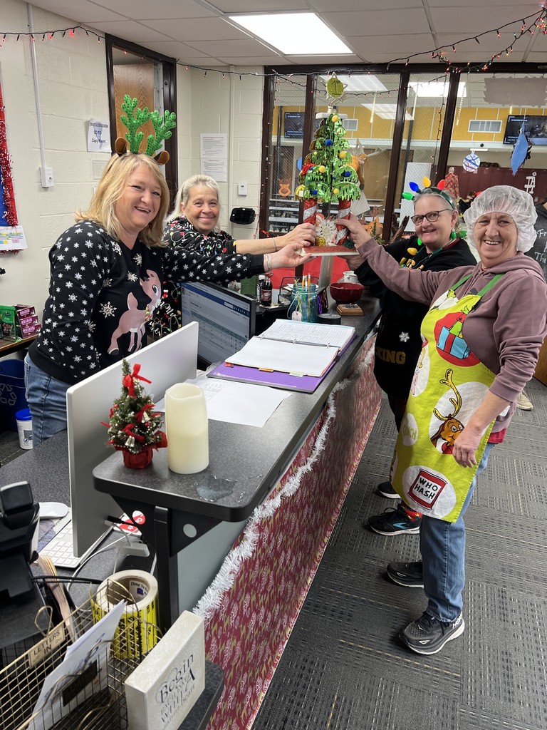 Mid-Prairie Middle School staff with Christmas trophy