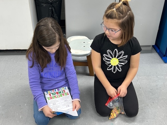 2nd grade students sharing their learning to 1st grade students
