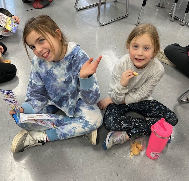 2nd grade students sharing their learning to 1st grade students