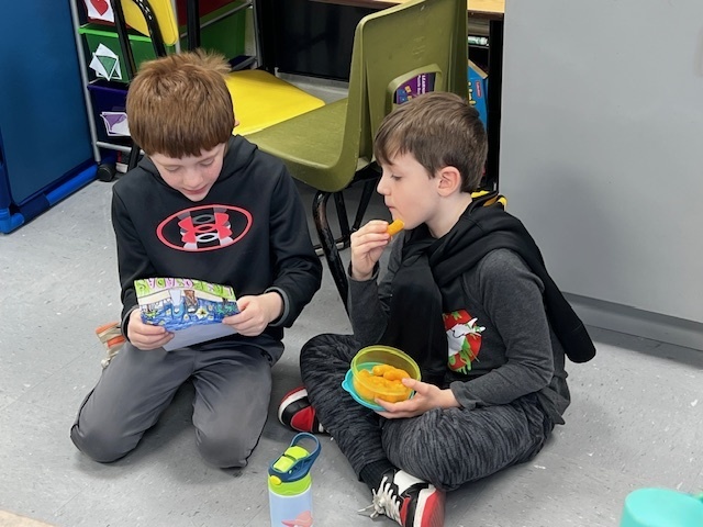 2nd grade students sharing their learning to 1st grade students