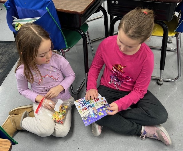 2nd grade students sharing their learning to 1st grade students