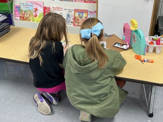 2nd grade students sharing their learning to 1st grade students