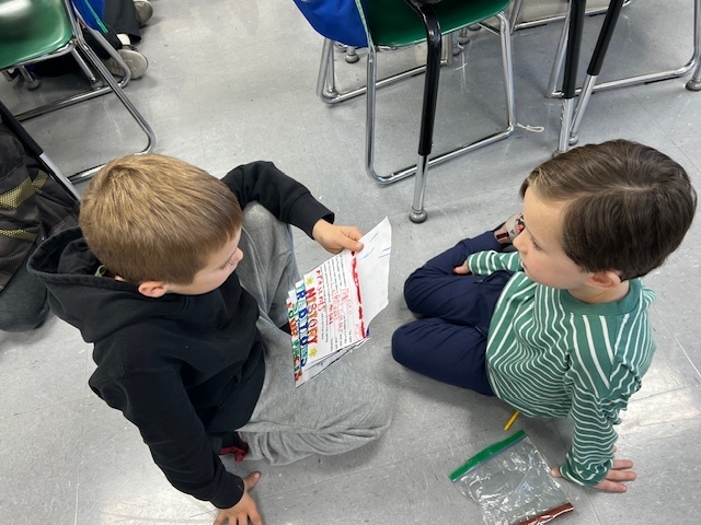 2nd grade students sharing their learning to 1st grade students
