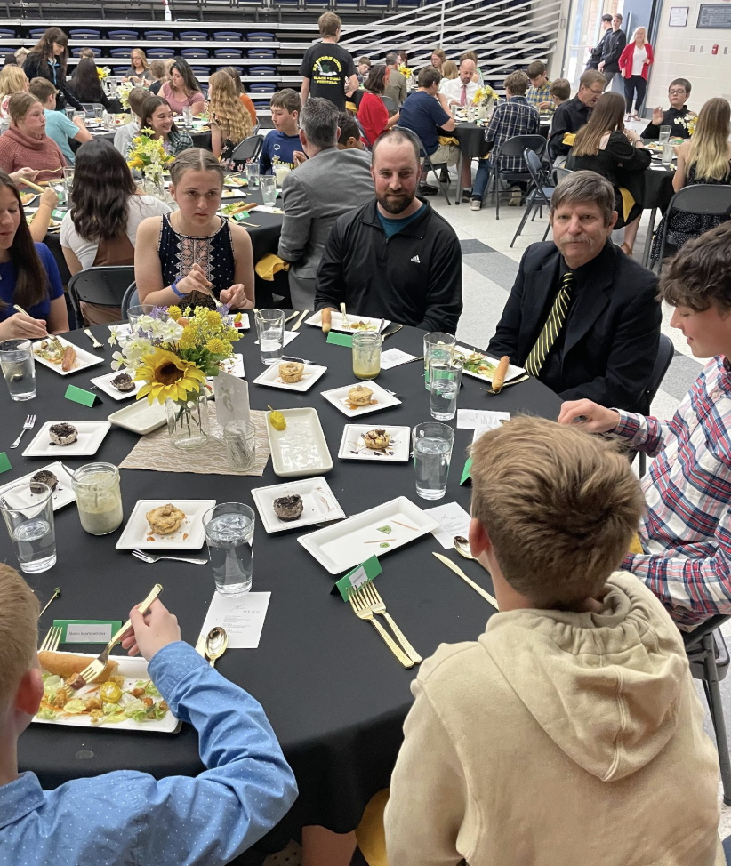 Students at ettiquette luncheon