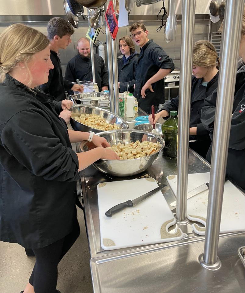 Cullinary students cooking the luncheon meal