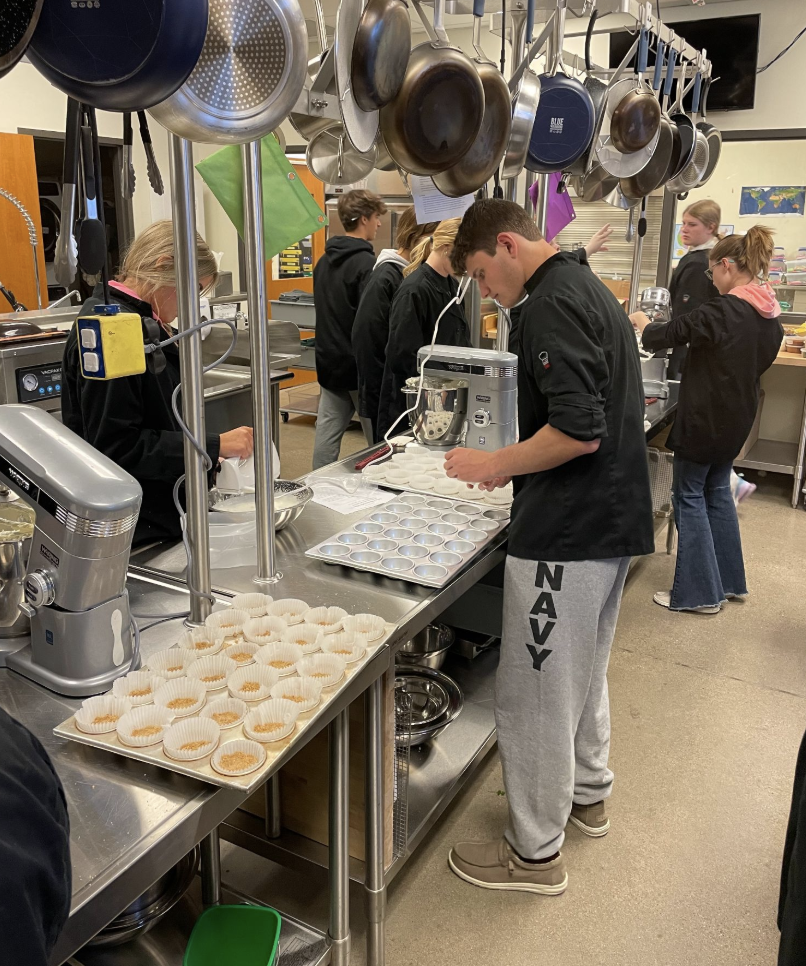 Cullinary students cooking the meal
