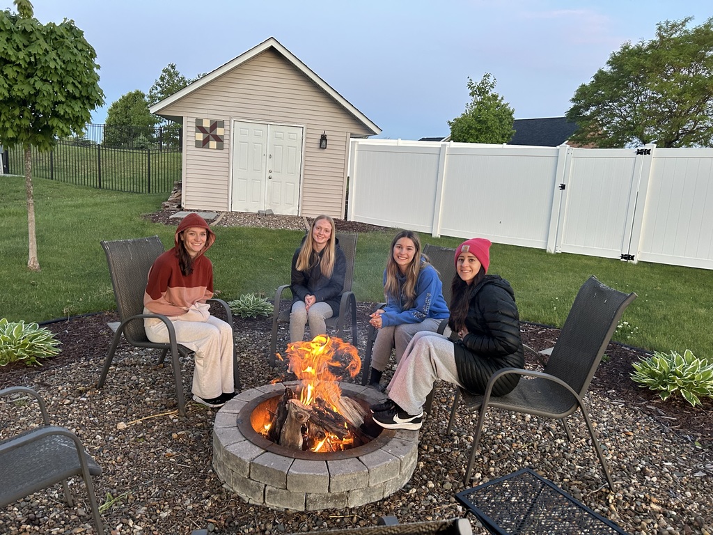 Students by a camp fire