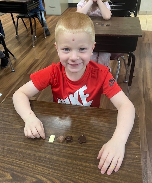 Kindergarten student with chocolate