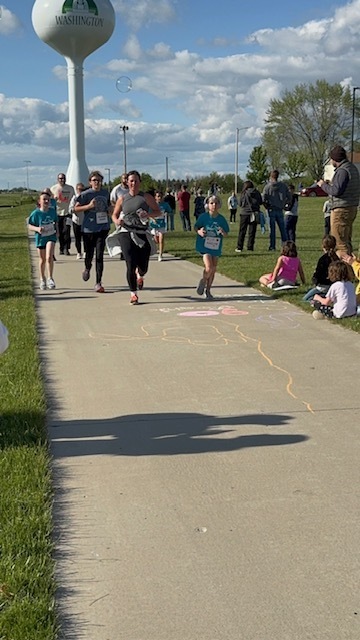 Students and their running buddies completing the race