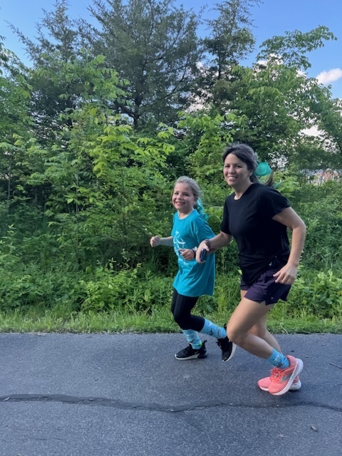 Student and her running buddy