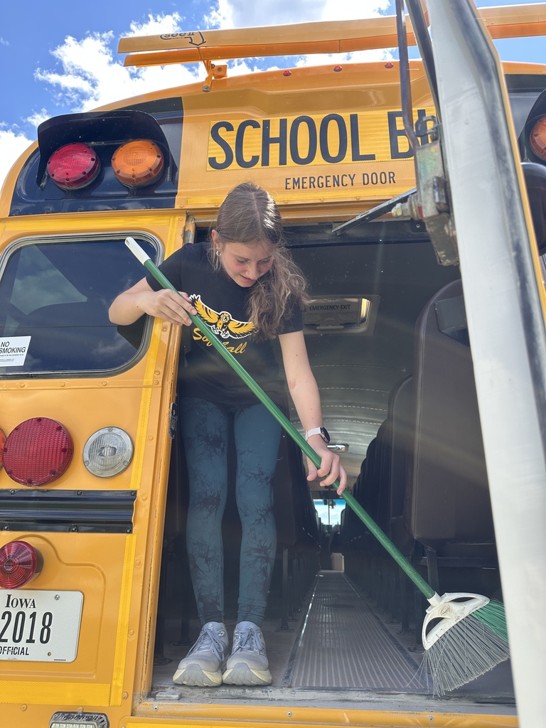 Student cleaning a bus