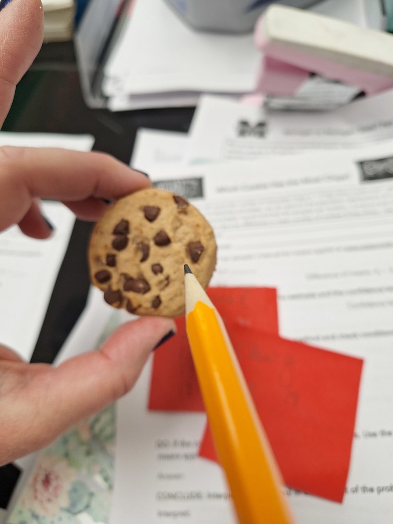 Pencil pointing to cookie
