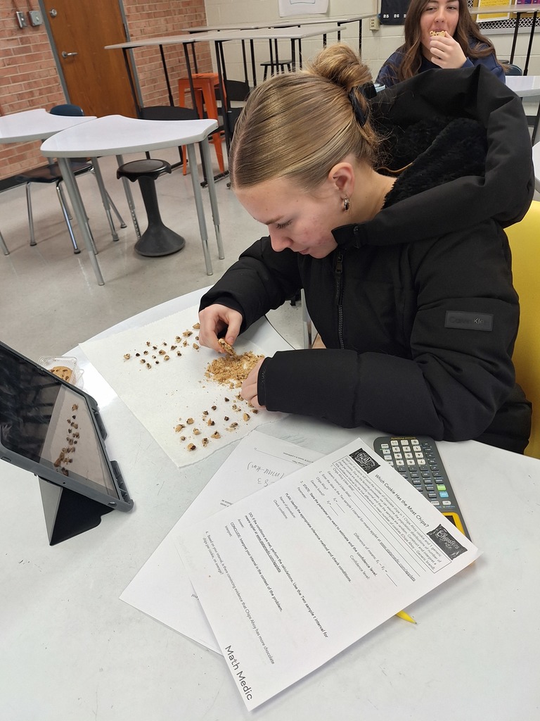 Student counting chips in each cookie