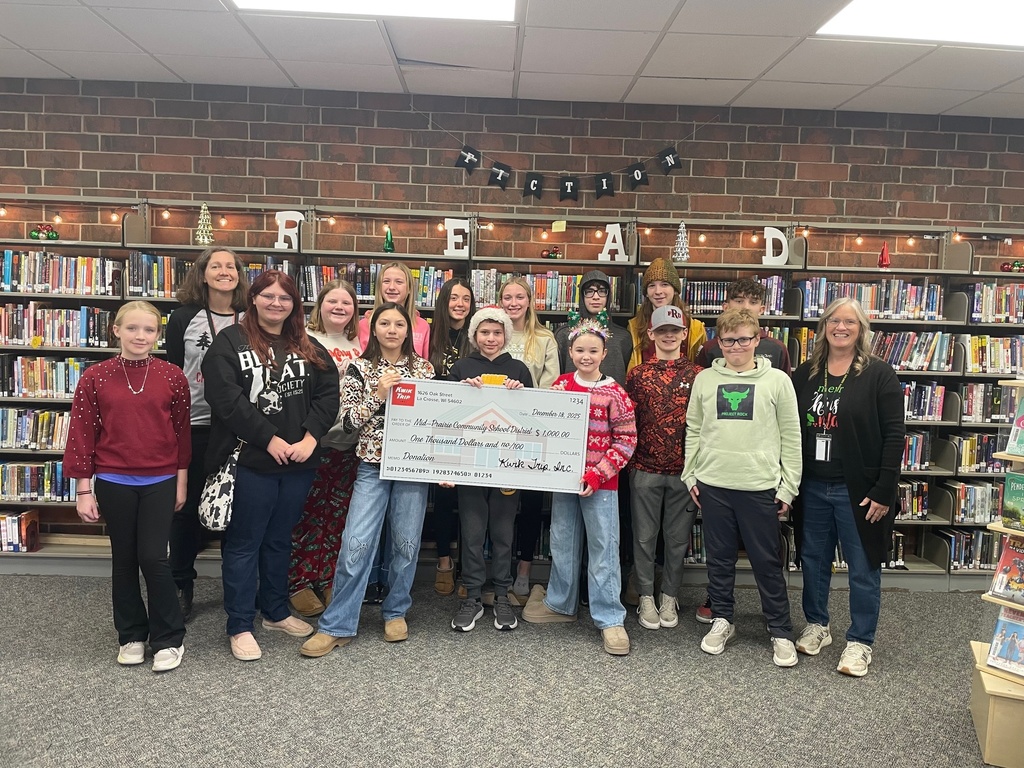 Students and staff with Kwik Trip donation check