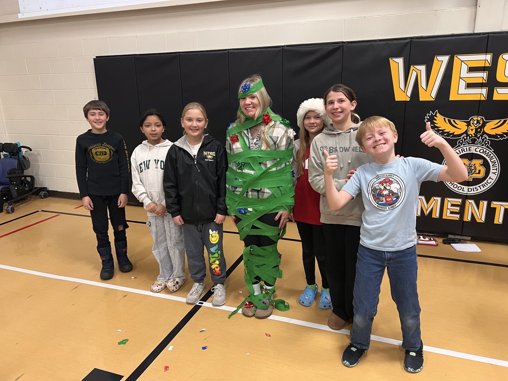 Students and staff member playing Christmas tree game