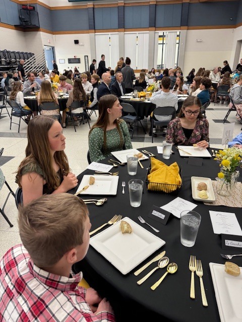 Students eating at a formal meal in the MPHS cafeteria from 2025