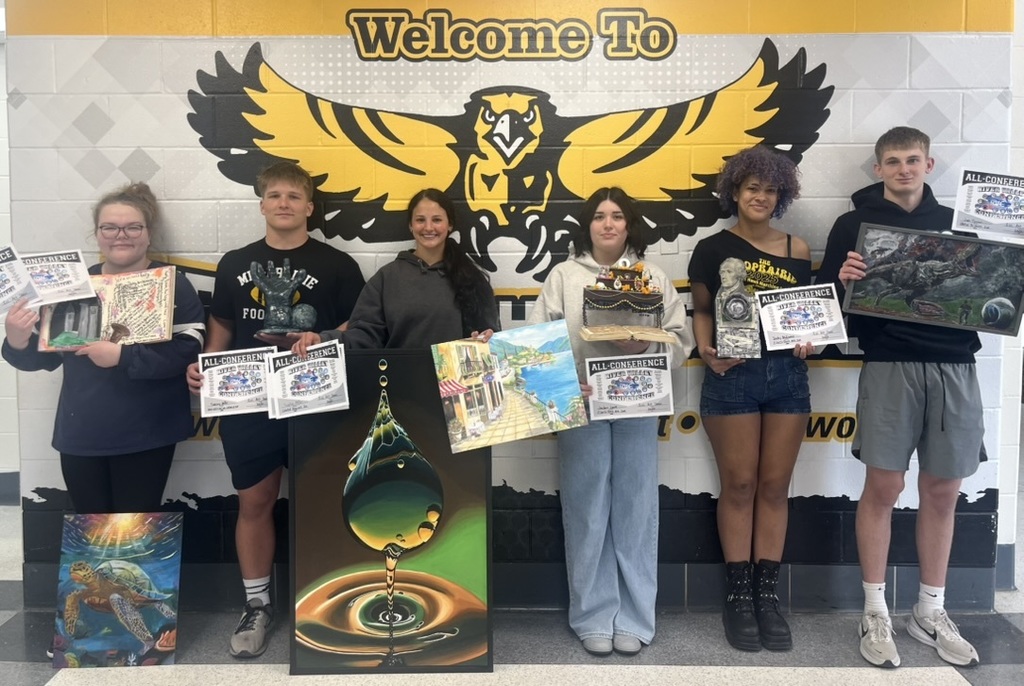 Students holding their artwork pieces and their all-conference awards