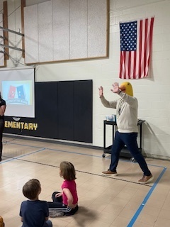Mr. Stone walking in with a duck hat