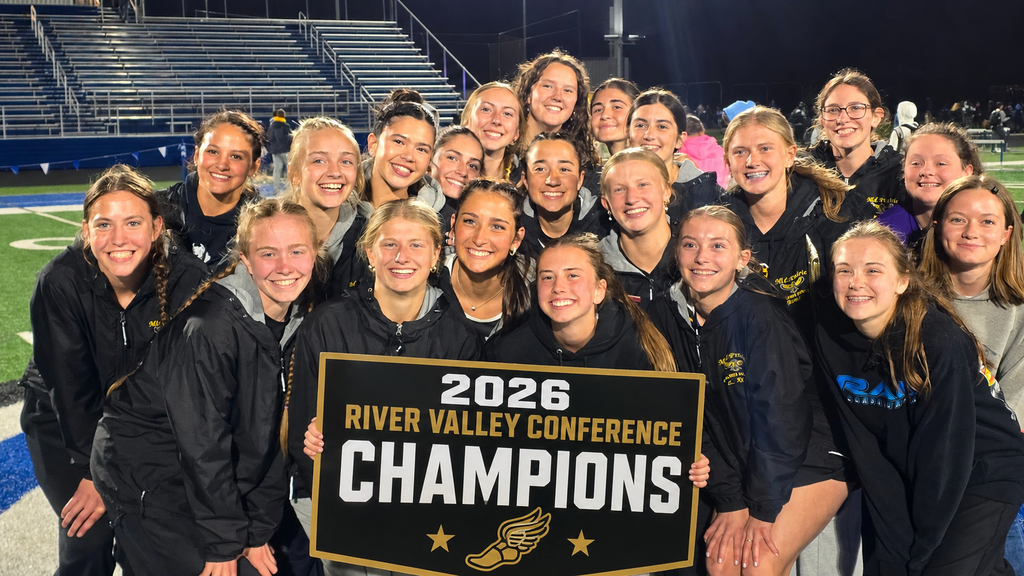 Group of Girls Track team together holding a sign that reads 2026 River Valley Conference Champions