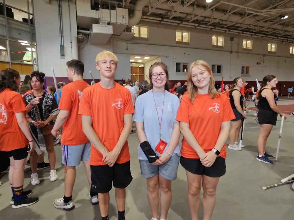 Thomas Lueck, Daniella Bohlen, and Wren Harris at Drum Major Camp wearing camp t-shirts