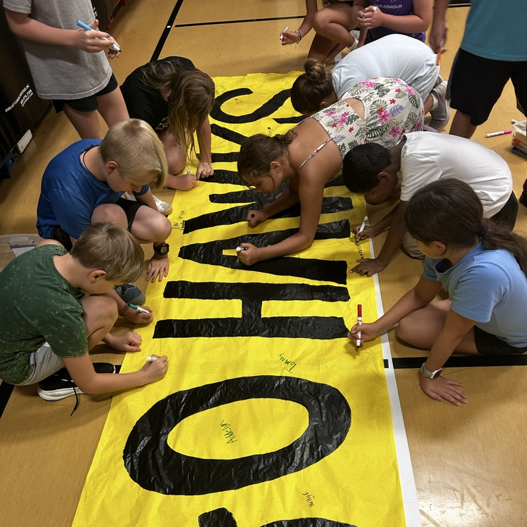 west students signing go hawks banner