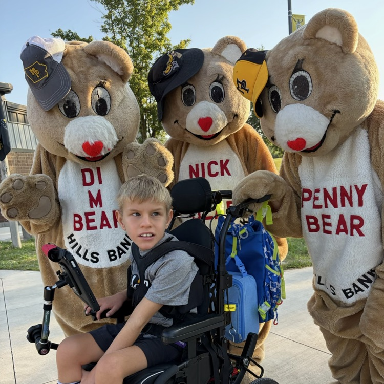 student in wheelchair in front of 3 bears