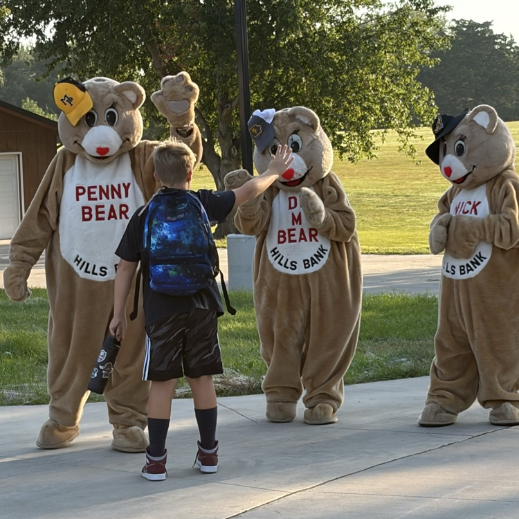 bears giving a student a high five
