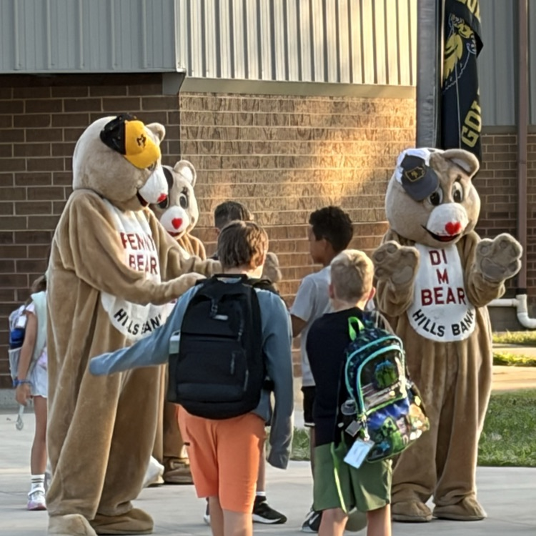 group of students surrounding the bears telling them good morning