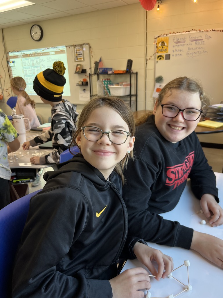 Students building a marshmallow tower
