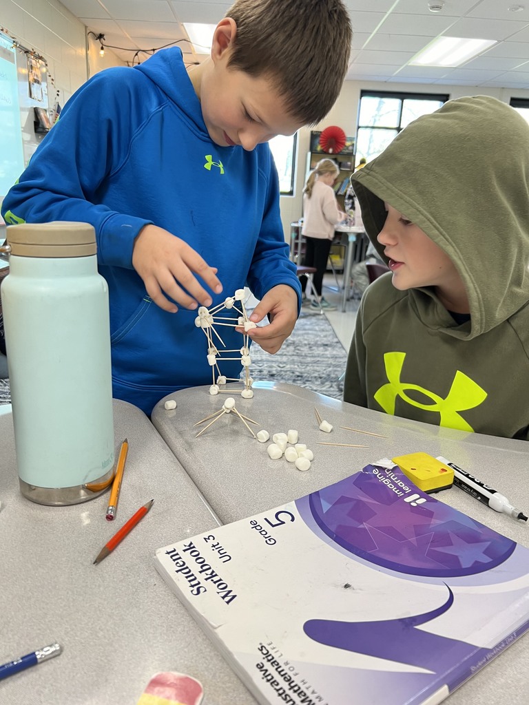 Students building a marshmallow tower