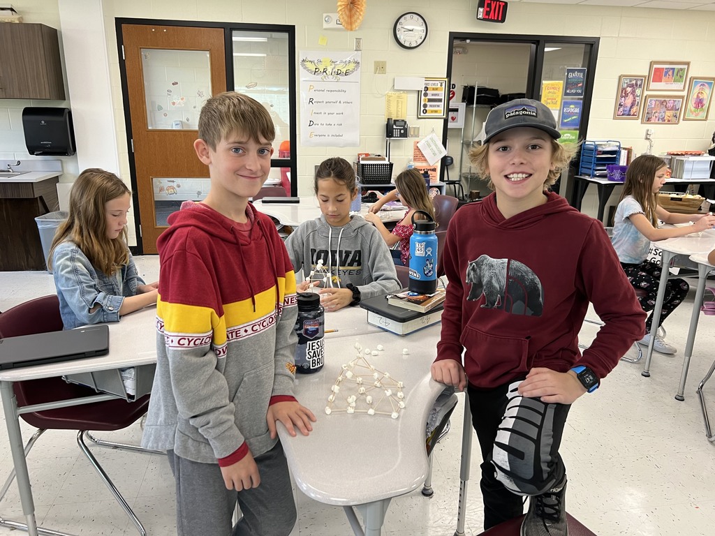 Students building a marshmallow tower