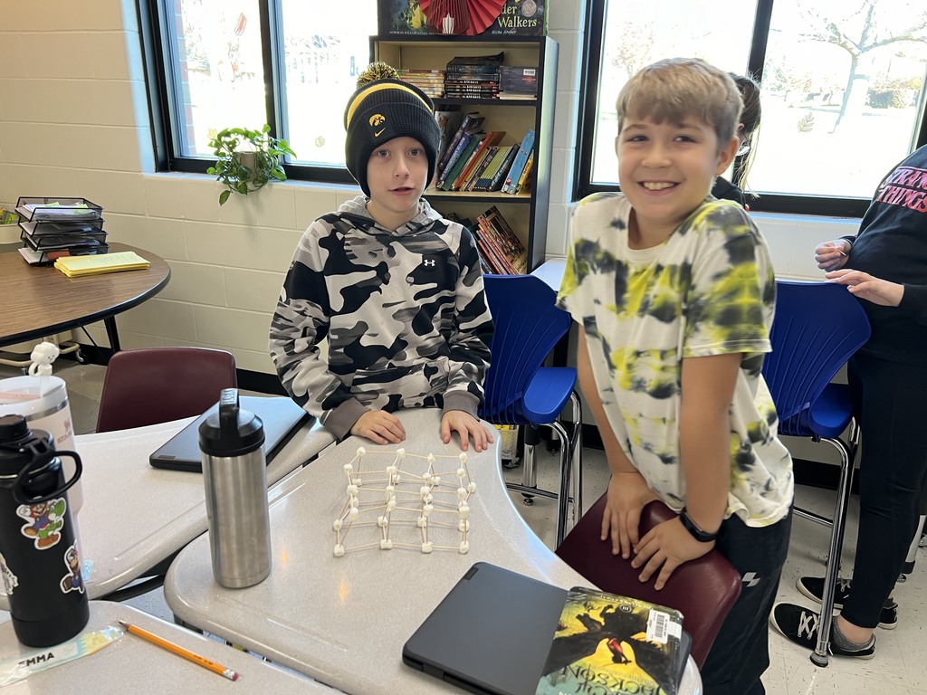 Students building a marshmallow tower