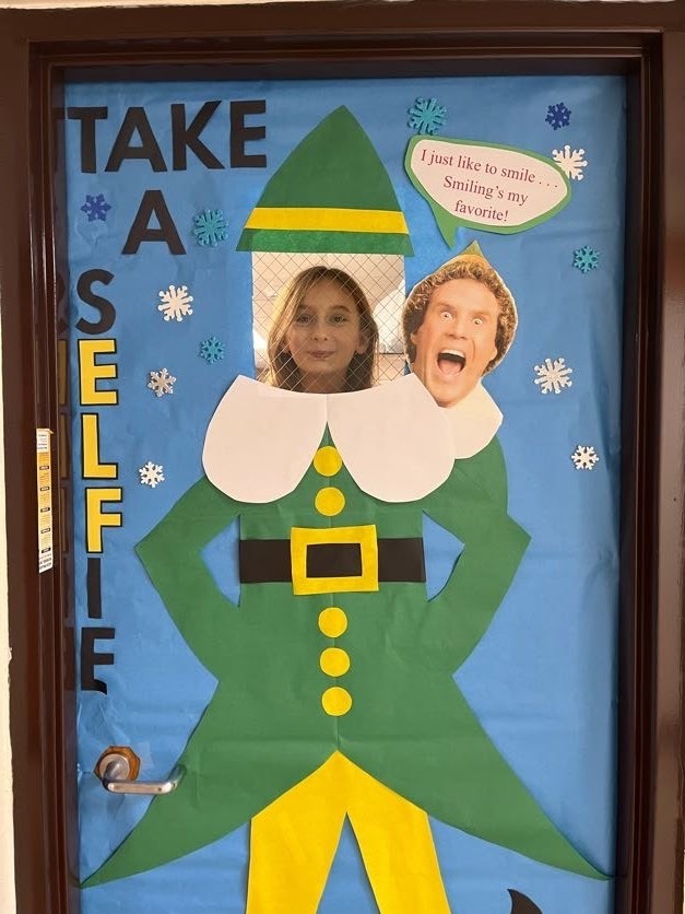 Student with a decorated Elf door