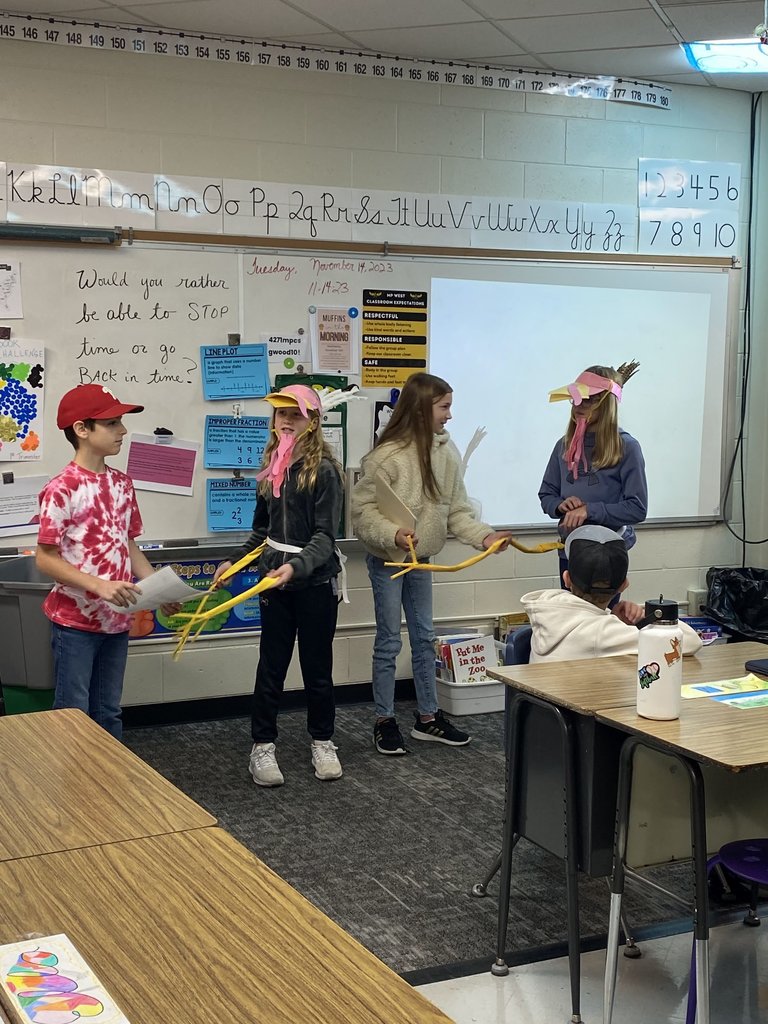 Students performing a reader's theater in costume